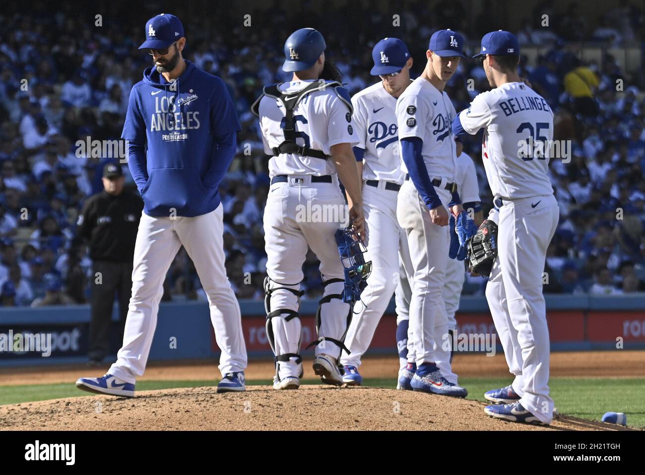 Los Angeles, United States. 19th Oct, 2021. Los Angeles Dodgers pitching  coach Mark Prior (L) leaves the mound after visiting with starter Walker  Buehler )second from right) during the fourth inning against