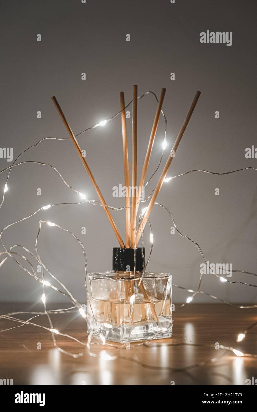 Bamboo Ambient Scent Sticks, Home Decor with warm lights. Stock Photo