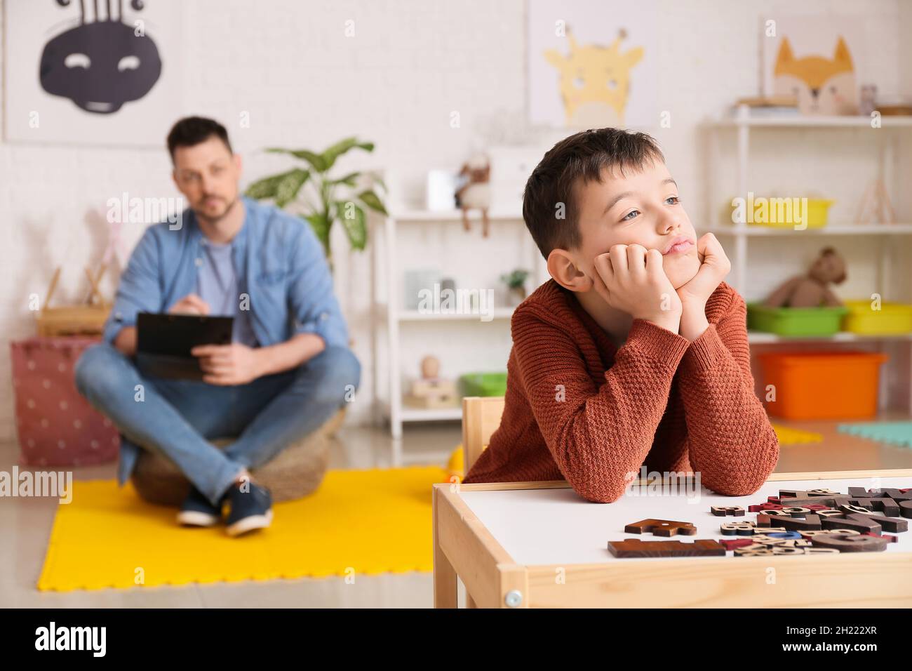 Little boy with autism spectrum disorder at psychologist's office Stock