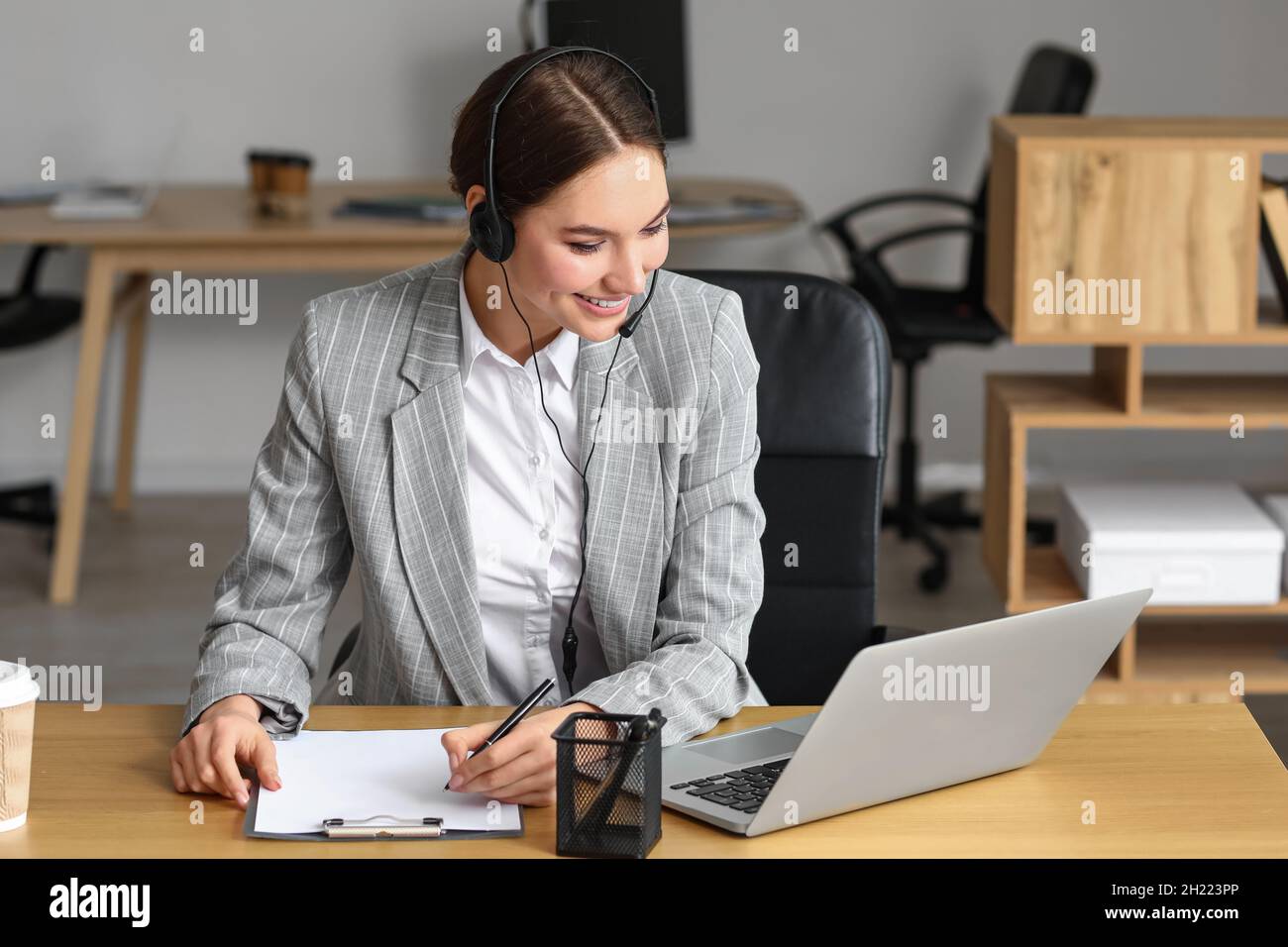 Technical support agent working in office Stock Photo - Alamy