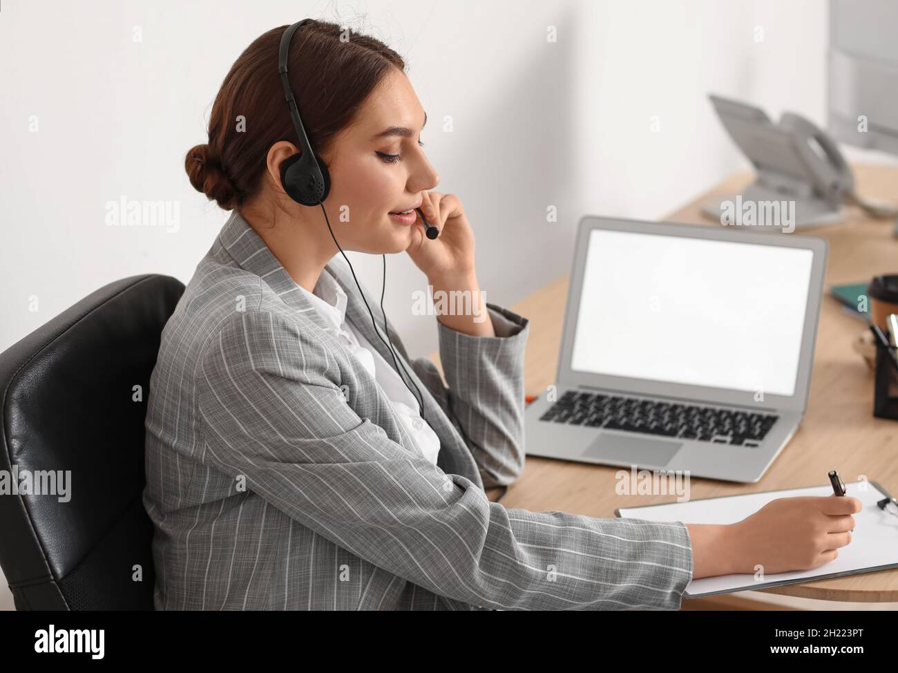 Technical support agent working in office Stock Photo - Alamy