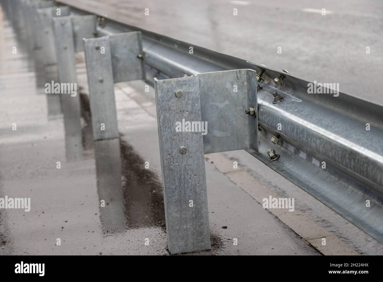 underscrewed nuts and bolts in highway road railing Stock Photo Alamy