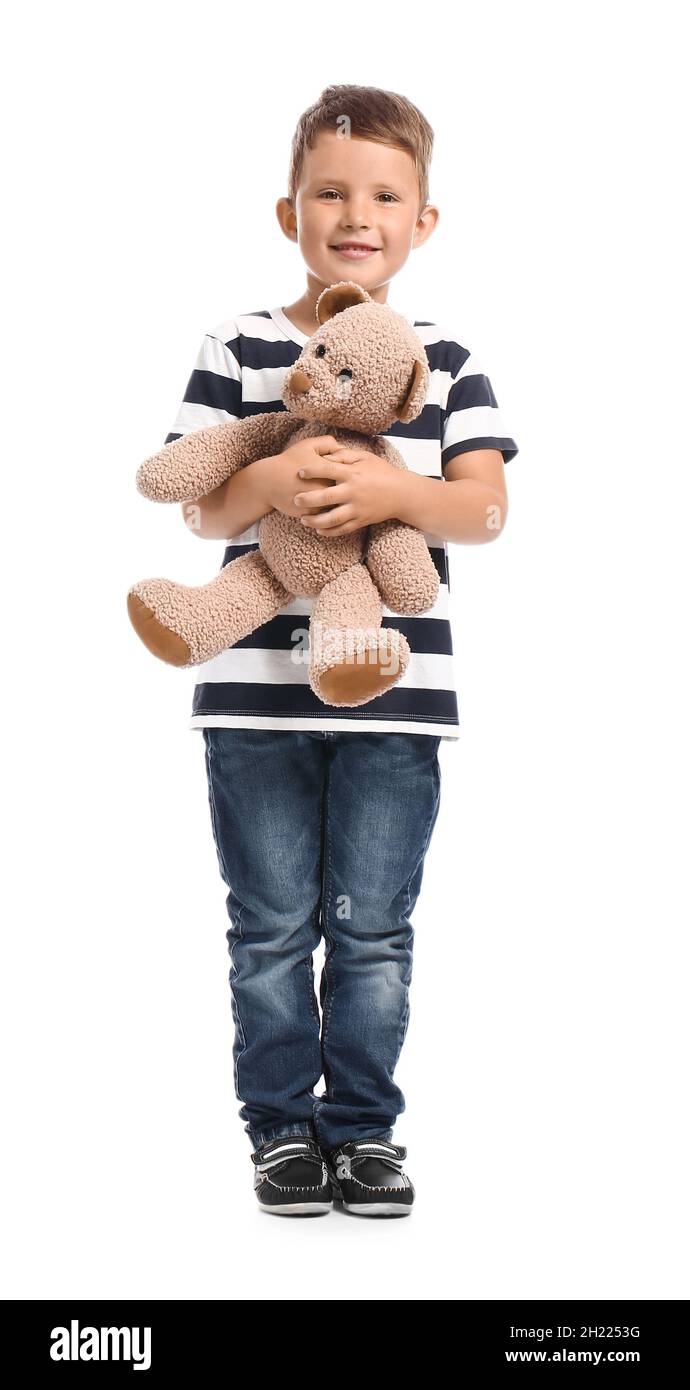 Cute little boy holding teddy bear on white background Stock Photo - Alamy