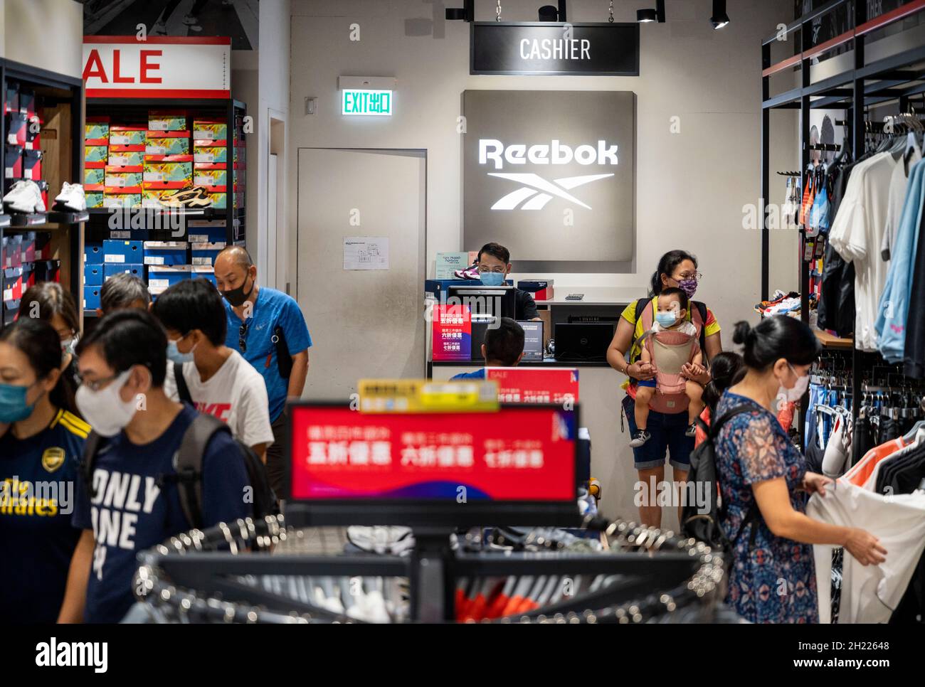 Shoppers seen at German multinational footwear company brand Reebok store seen at Tung Chung district Hong Kong Stock Photo - Alamy