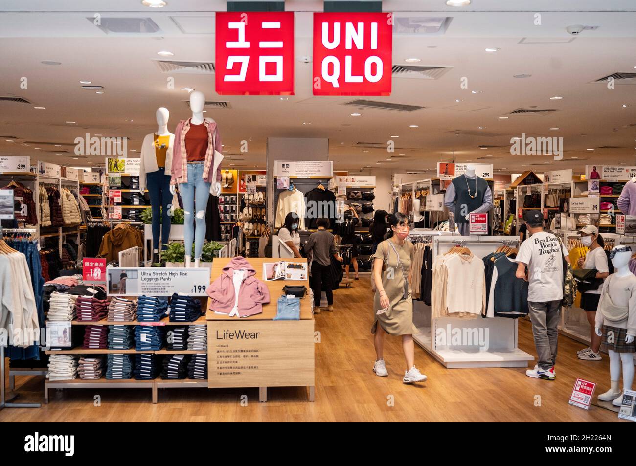 Shoppers are seen at the Japanese clothing brand Uniqlo store at Tung Chung  district in Hong Kong Stock Photo - Alamy