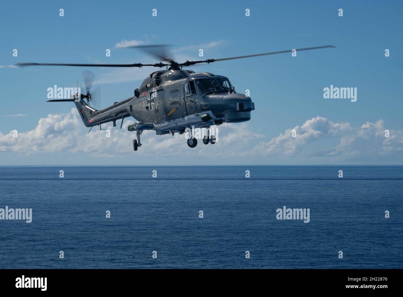 211018-N-FA490-1442 PHILIPPINE SEA (Oct. 18, 2021) Independence-variant littoral combat ship USS Jackson (LCS 6) sails with German Navy frigate FGS Bayern (F 217) and embarked Super Lynx Mk88A helicopters in the Philippine Sea. Jackson, part of Destroyer Squadron Seven, is on a rotational deployment in the U.S. 7th Fleet area of operation to enhance interoperability with partners and serve as a ready-response force in support of a free and open Indo-Pacific region. (U.S. Navy photo by Mass Communication Specialist 3rd Class Andrew Langholf/released) Stock Photo