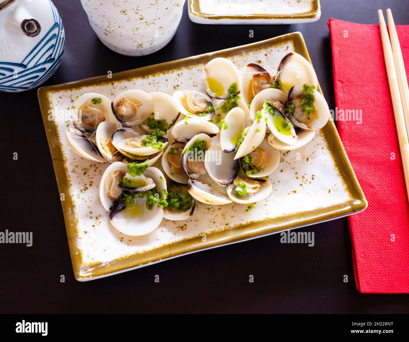 Japanese steamed clams with butter, sake, mirin and scallion Stock