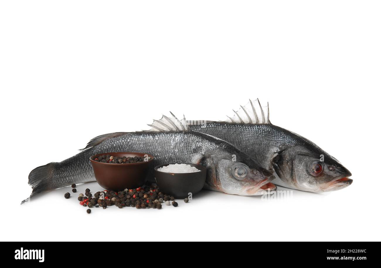 Fresh uncooked sea bass fish on white background Stock Photo - Alamy