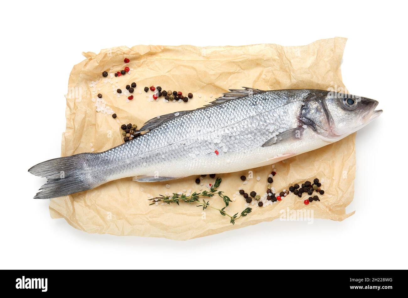 Fresh uncooked sea bass fish on white background Stock Photo - Alamy