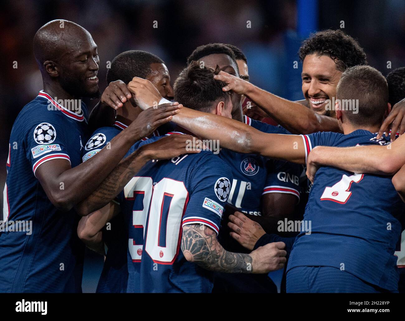 PARIS, FRANCE - OCTOBER 19 Lionel Messi of Paris Saint-Germain celebrate with Marquinhos and Danilo after scoring hes 2nd goal during the UEFA Cham Stock Photo