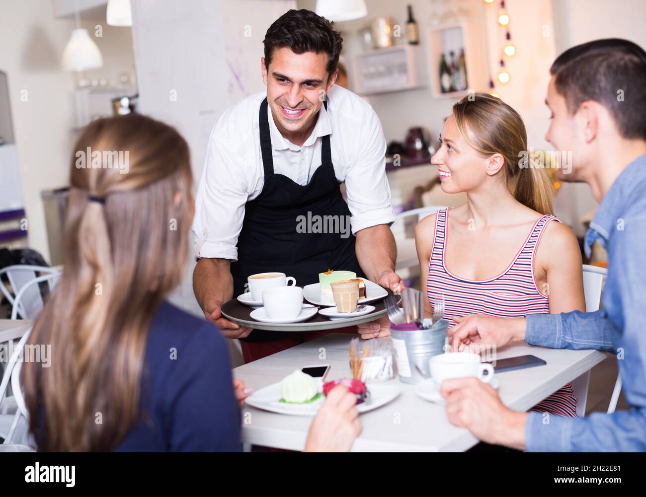 Waitering Woman ordering male waiter hi-res stock photography and images - Alamy