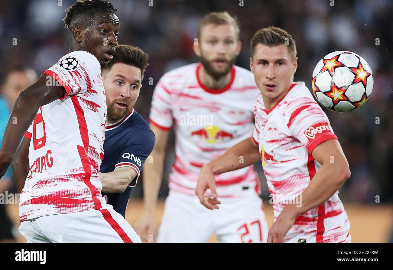 Paris, France. 19th Oct, 2021. Lionel Messi (2nd L) of Paris Saint-Germain competes with Amadou Haidara (1st L) of RB Leipzig during the Champions League Group A soccer match between Paris Saint-Germain and RB Leipzig at the Parc des Princes in Paris, France, Oct. 19, 2021. Credit: Gao Jing/Xinhua/Alamy Live News Stock Photo
