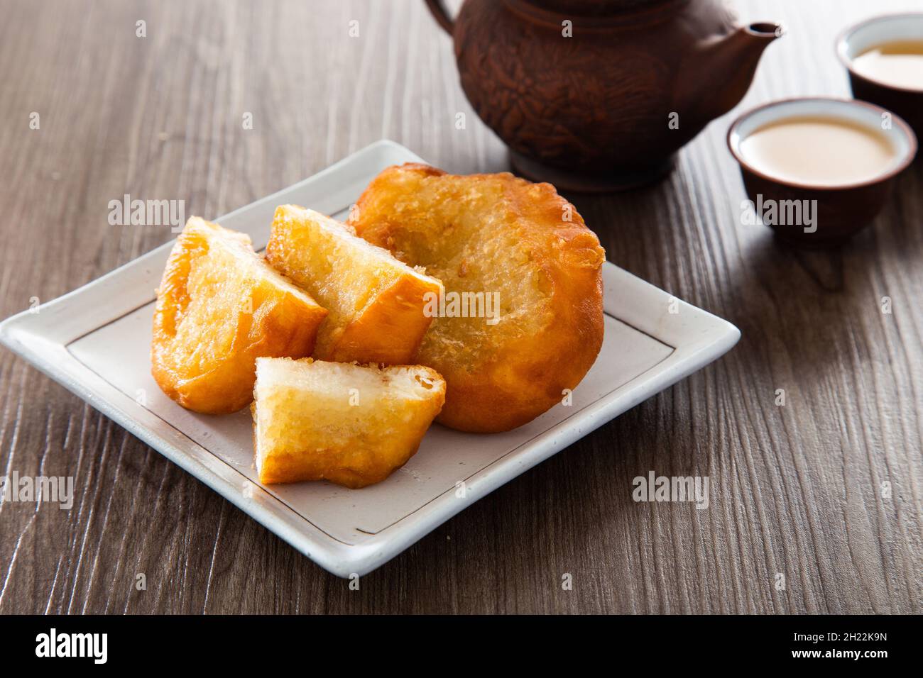 Ham chim peng. (deep-fried chinese doughnut). There are at least 3 varieties of ham chin peng - with glutinous rice, five spice powder and red bean pa Stock Photo