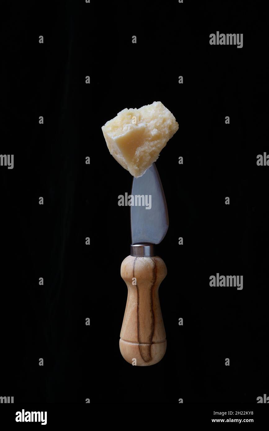 Parmesan cheese on cheese knife, Germany Stock Photo Alamy