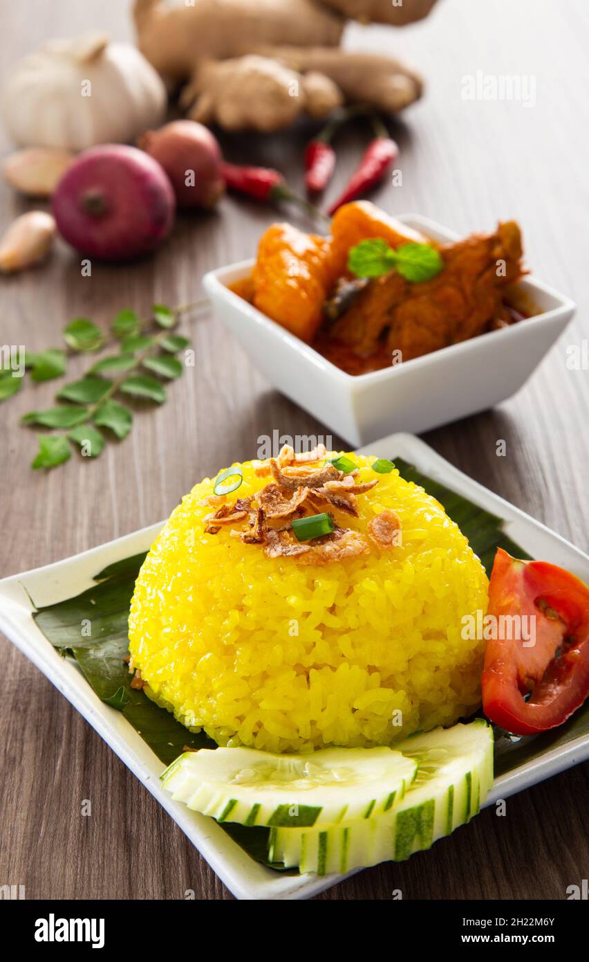 Turmeric Glutinous Rice also known as Nasi Kunyit. Normally eaten with dry curry chicken Stock