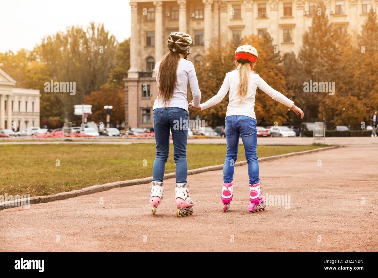 Cute children roller skating on city street Stock Photo Alamy