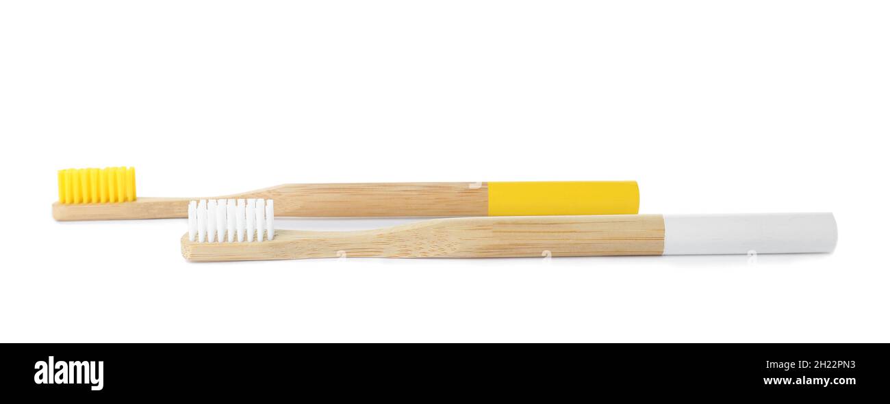 Bamboo toothbrushes on white background. Dental care Stock Photo - Alamy