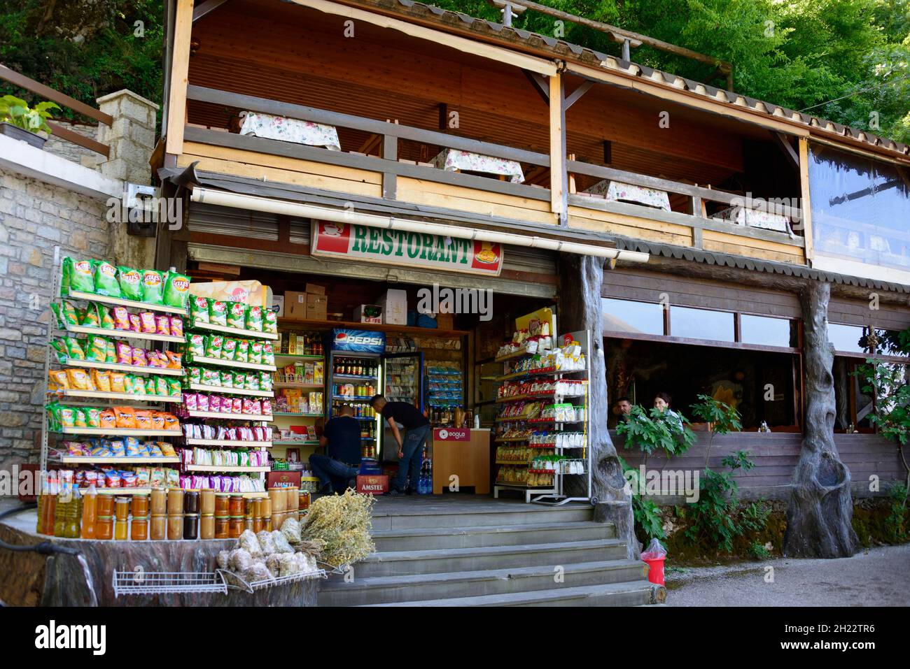 Sales stall and restaurant, Uji i Ftothe, Albania Stock Photo