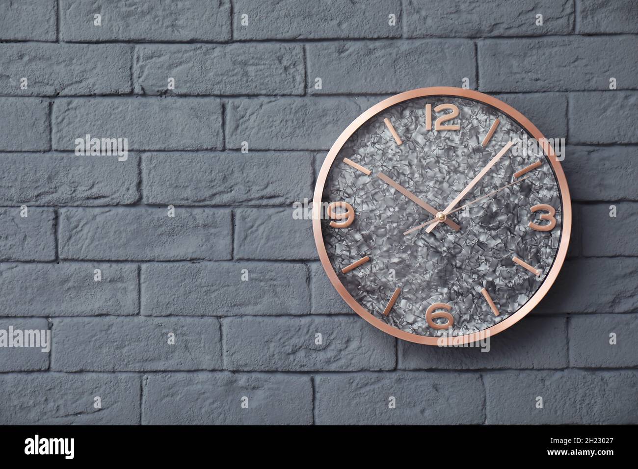 Modern clock on brick wall. Time concept Stock Photo Alamy
