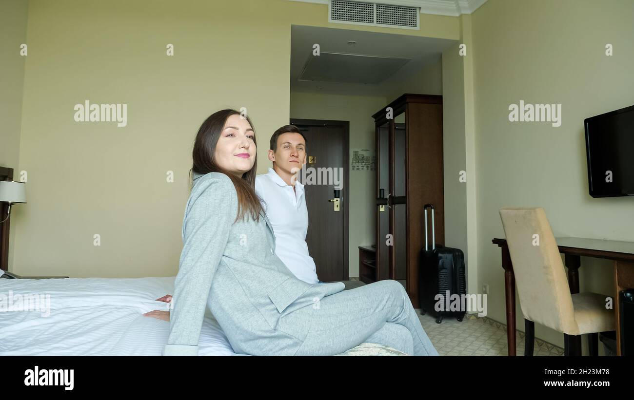Suitcase on bed inside hotel hi-res stock photography and images - Alamy