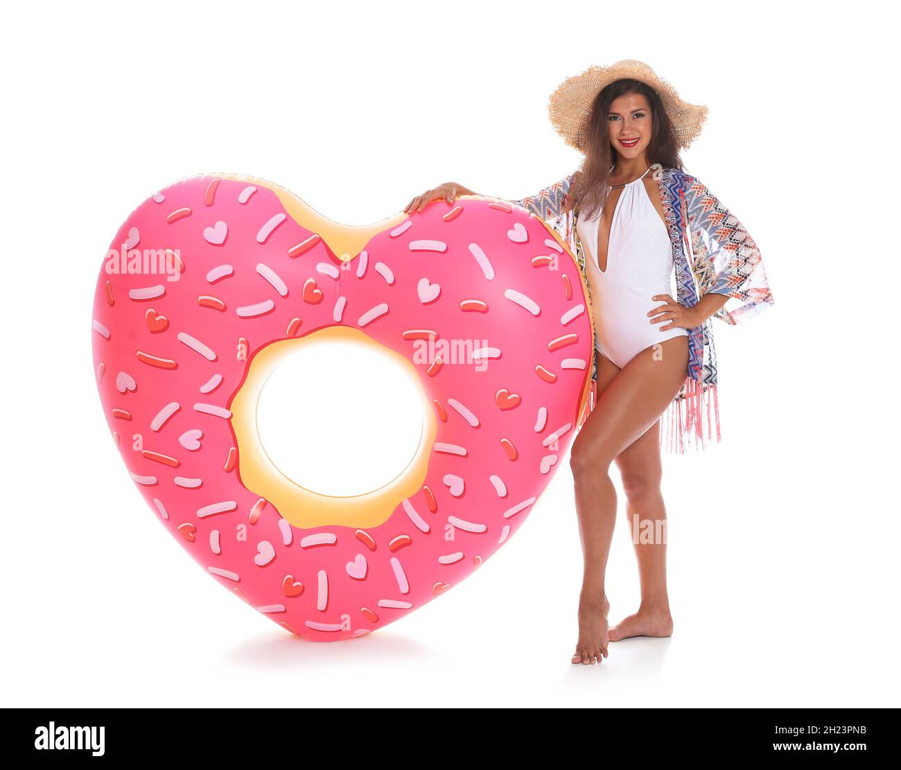 Beautiful young woman with inflatable heart on white background Stock Photo  - Alamy