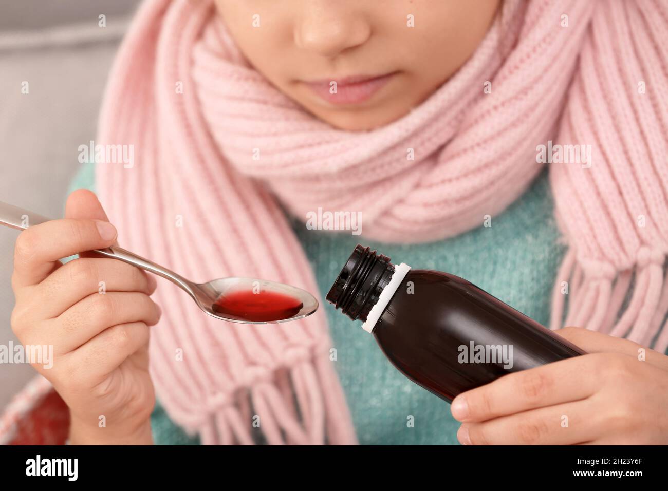 Little girl taking cough syrup, closeup view Stock Photo Alamy