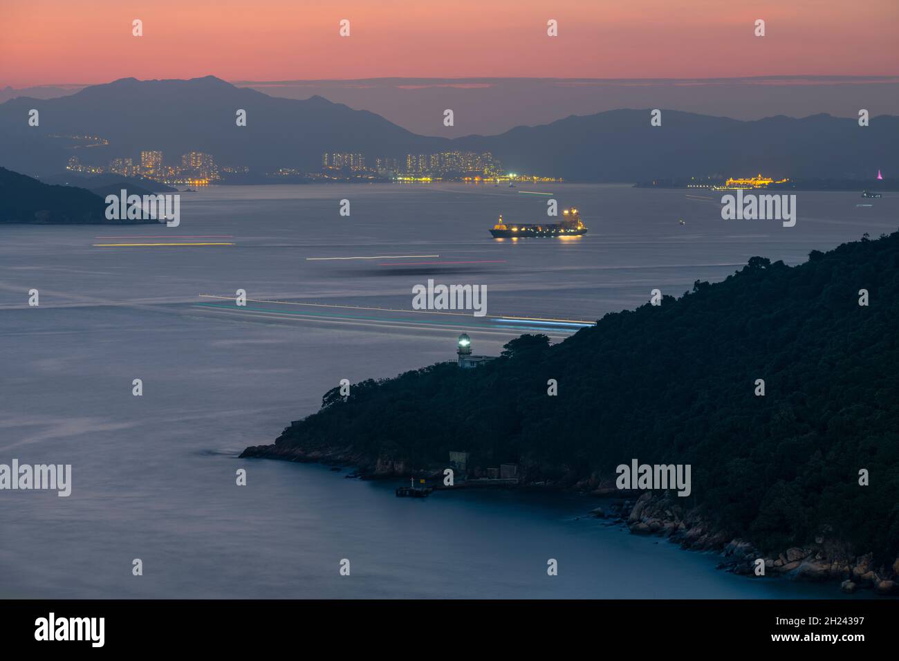 Green island lighthouse and Victoria Harbour, Hong Kong, China Stock