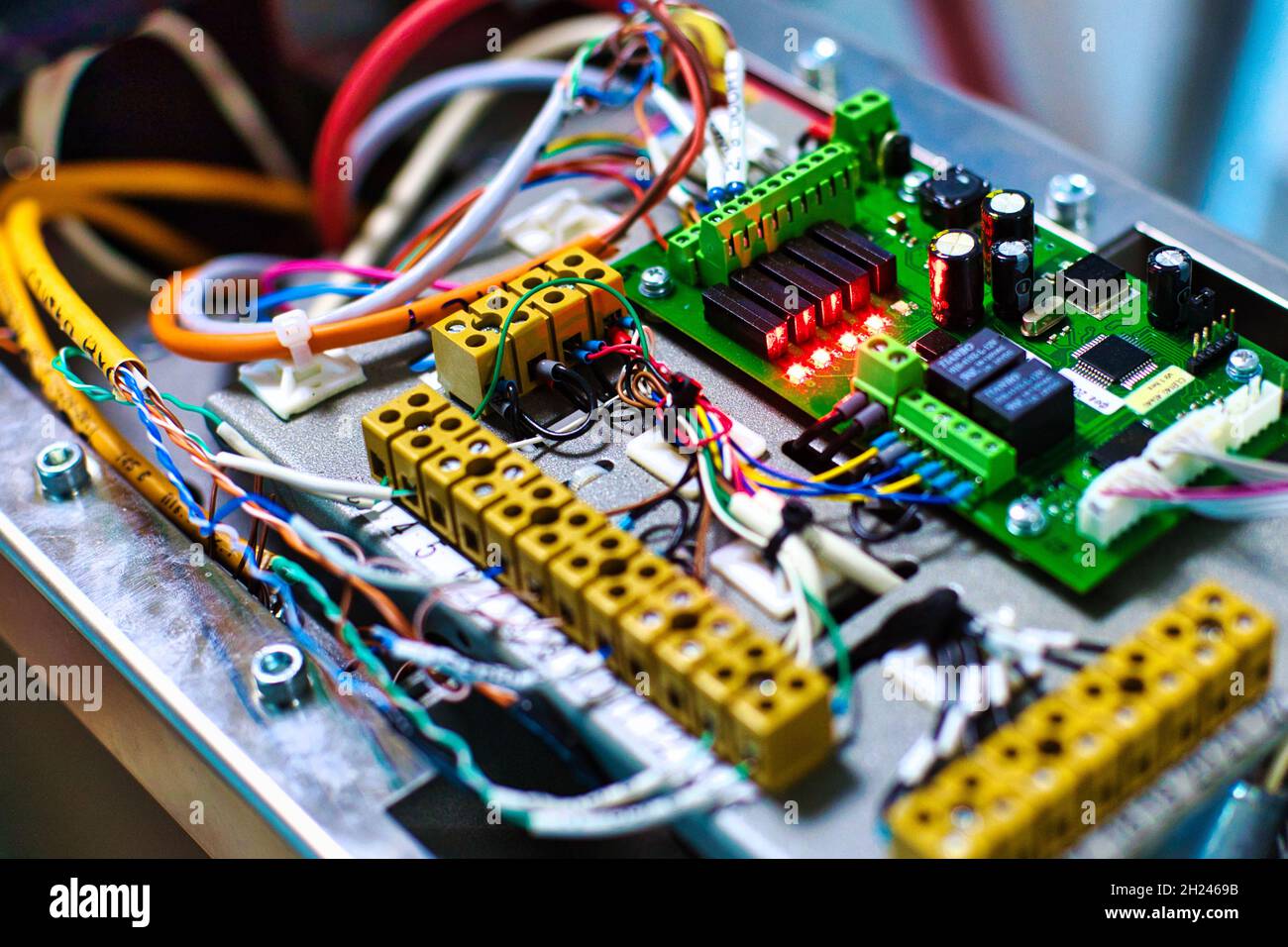 Electronic device with wires and chips close-up. Background Stock Photo