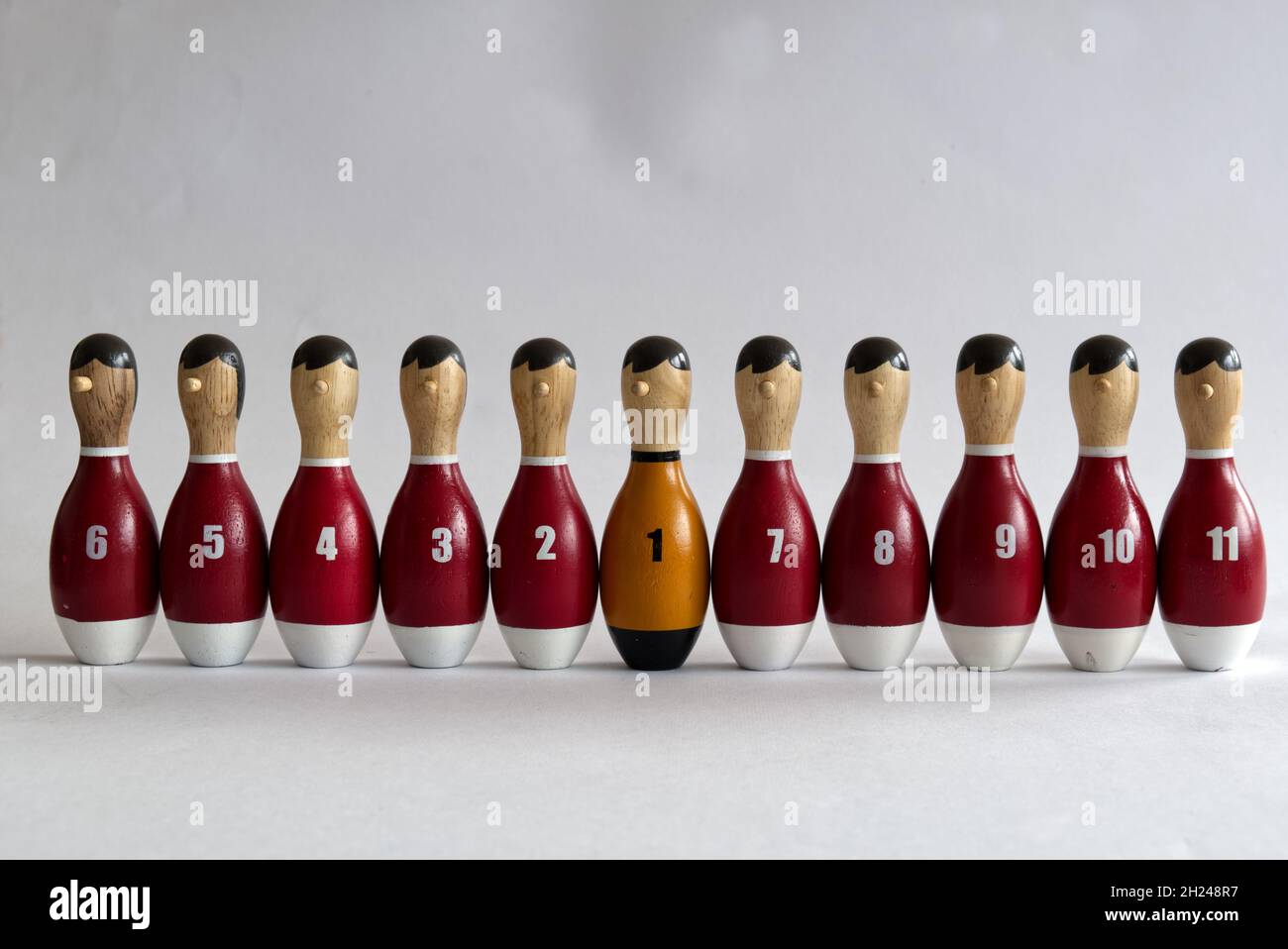 set-of-wooden-bowling-kegels-or-pins-painted-as-sports-team-members