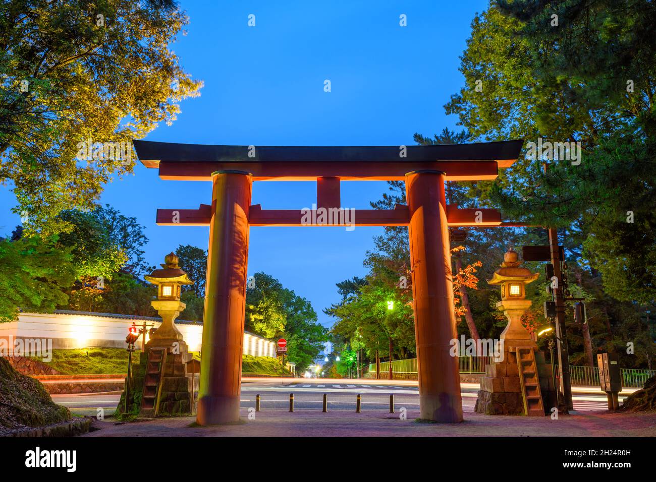 Red torii gate Ichi No Torii at entrance to Kasuga Taisha Shrine, Nara, Japan. Stock Photo