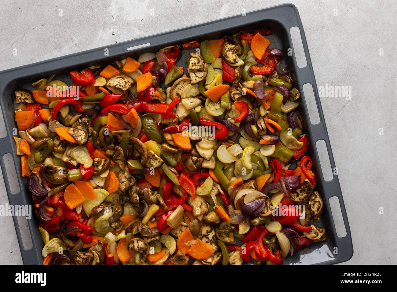 Fresh assorted autumn cut vegetables on a baking sheet, oven baked vegetables, top view Stock Photo