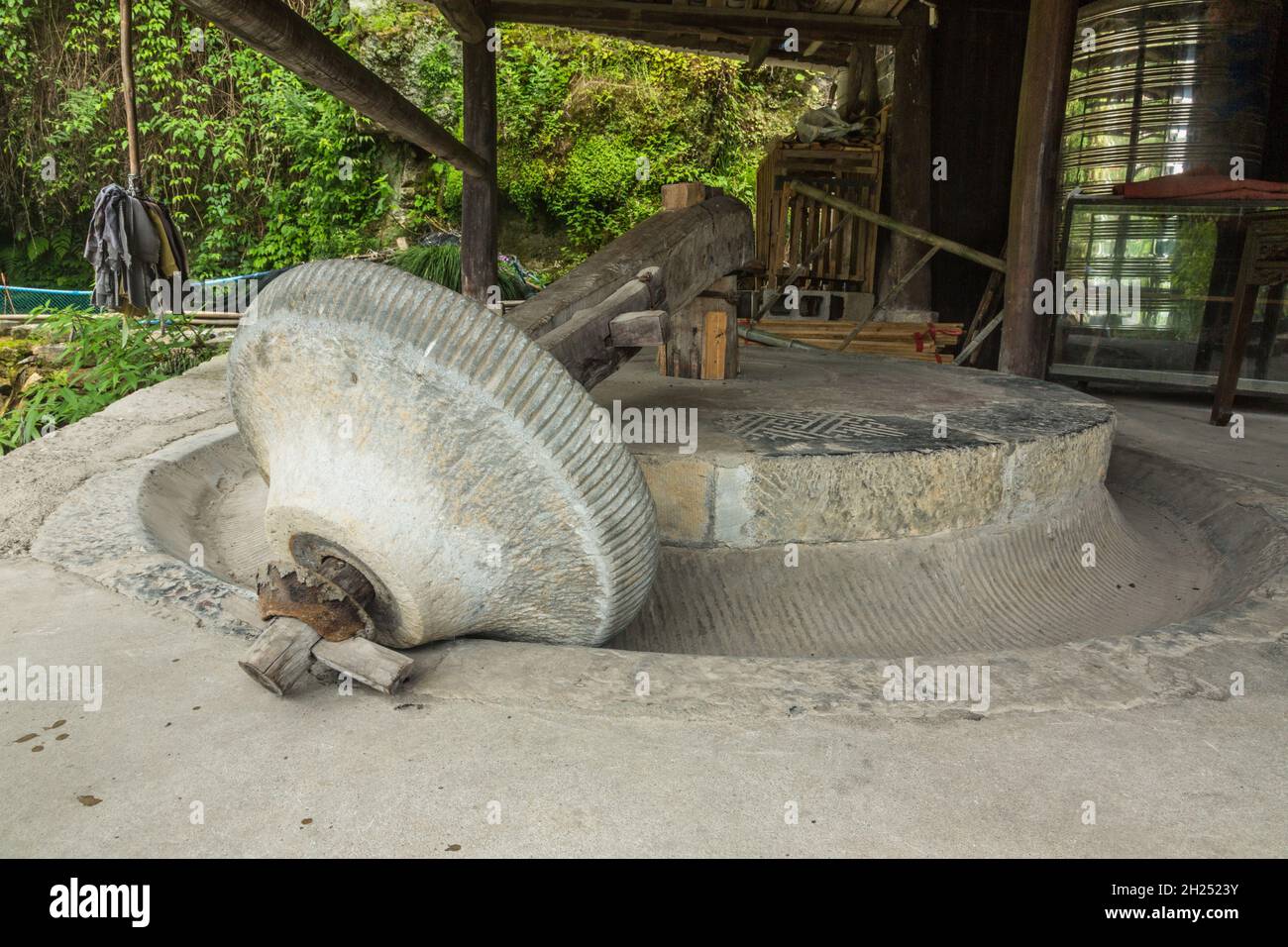 An old stone grist mill in the ancient town of Furong, China. Stock Photo
