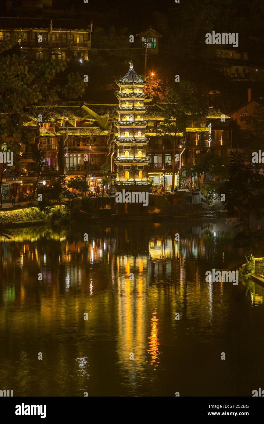 The Wanming Pagoda reflected in the Tuojiang River, Fenghuang, China at night. Stock Photo