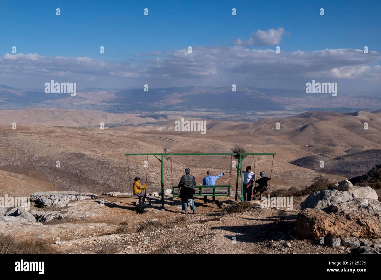 Israeli civilians stand at Matan Lookout overlooking the eastern hills of Samaria also known as Nablus Mountains located on the Gidonim ridge (a hilltop on which several Jewish settlements are located), above the Israeli settlement of Itamar in the West bank. Israel Stock Photo