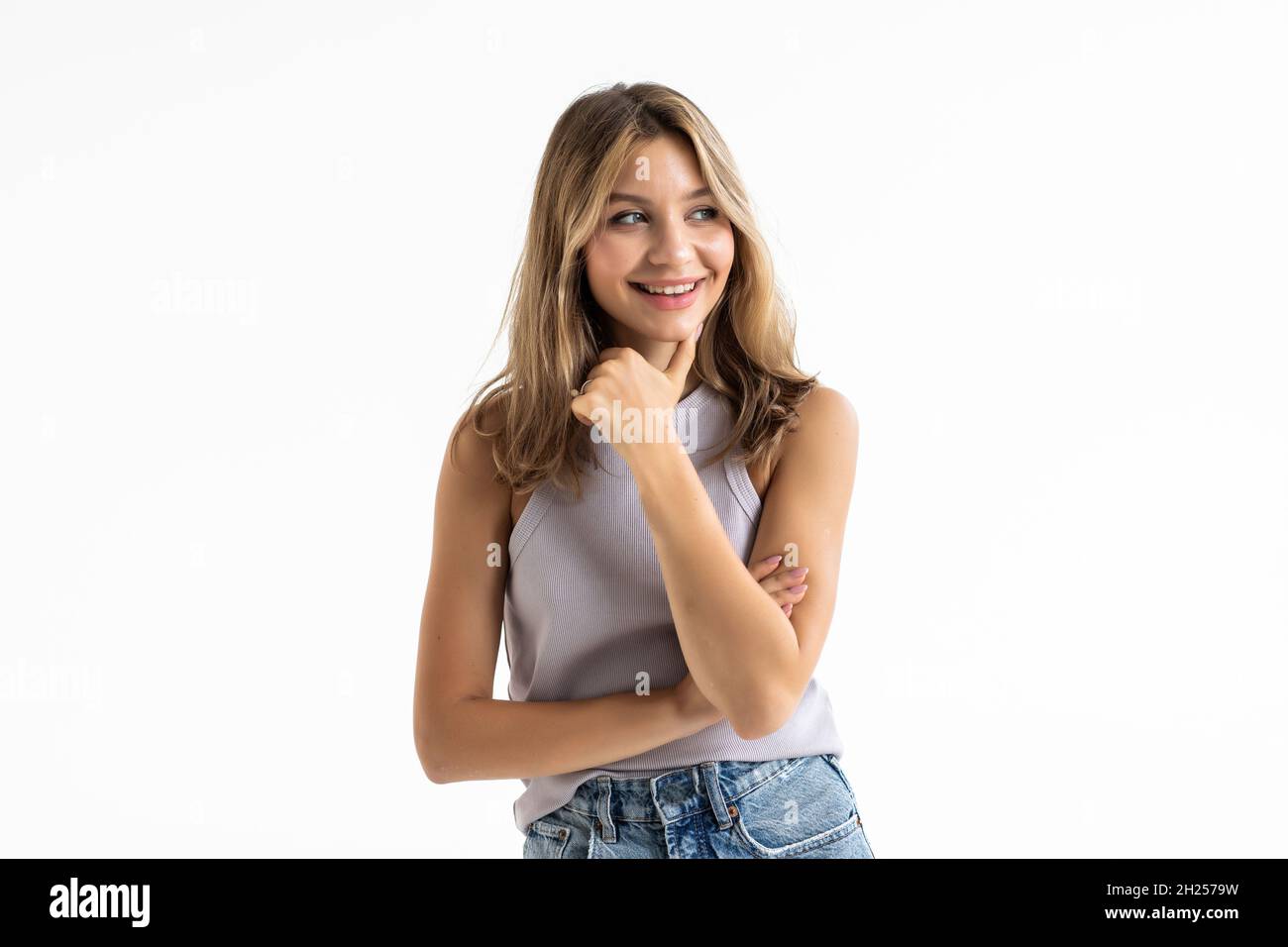 Young woman posing and smiling over white background Stock Photo - Alamy