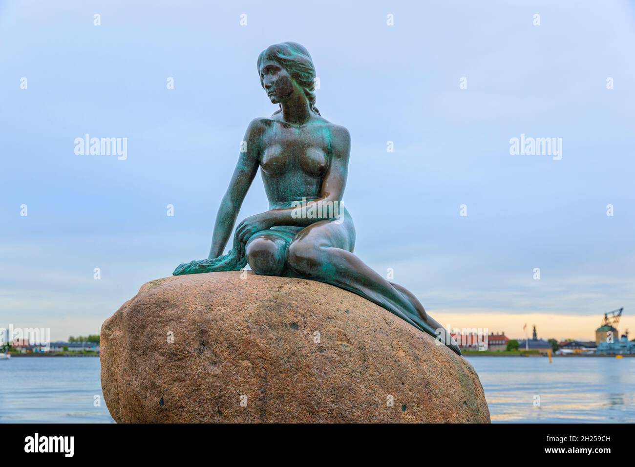 Copenhagen, Denmark, September 21, 2021: The Little Mermaid, statue by Edvard Eriksen on a rock in the water at the Langelinie promenade Stock Photo