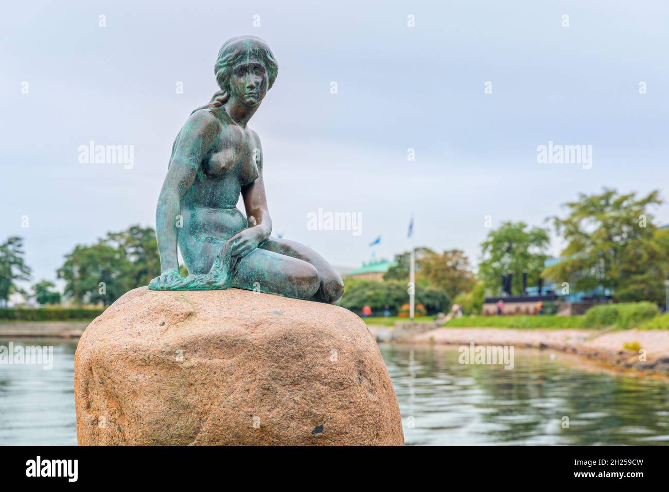 Copenhagen, Denmark, September 21, 2021: The Little Mermaid, statue by Edvard Eriksen on a rock in the water at the Langelinie promenade Stock Photo