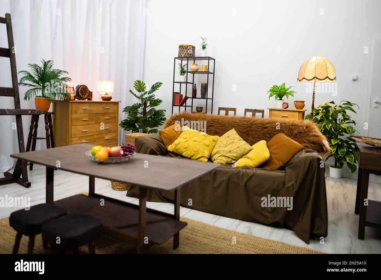 Furnished large bright living room home in warm brown color scheme ...