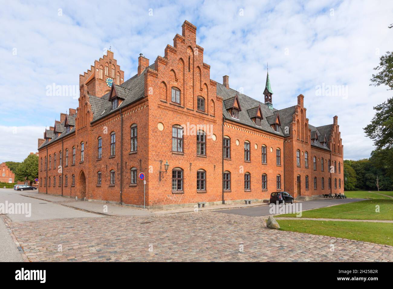 Church and former monastery buildings at Herlufsholm, Næstved, Denmark, inhabiting a boarding school Stock Photo