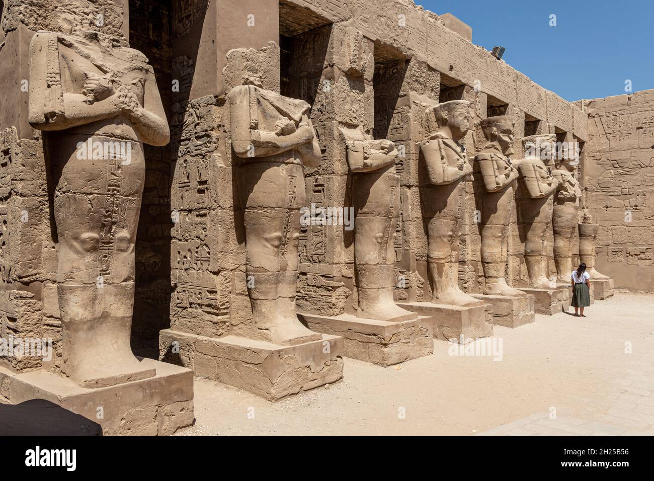 The statues of Pharaoh Ramses III as Osiris guarding the precinct of ...