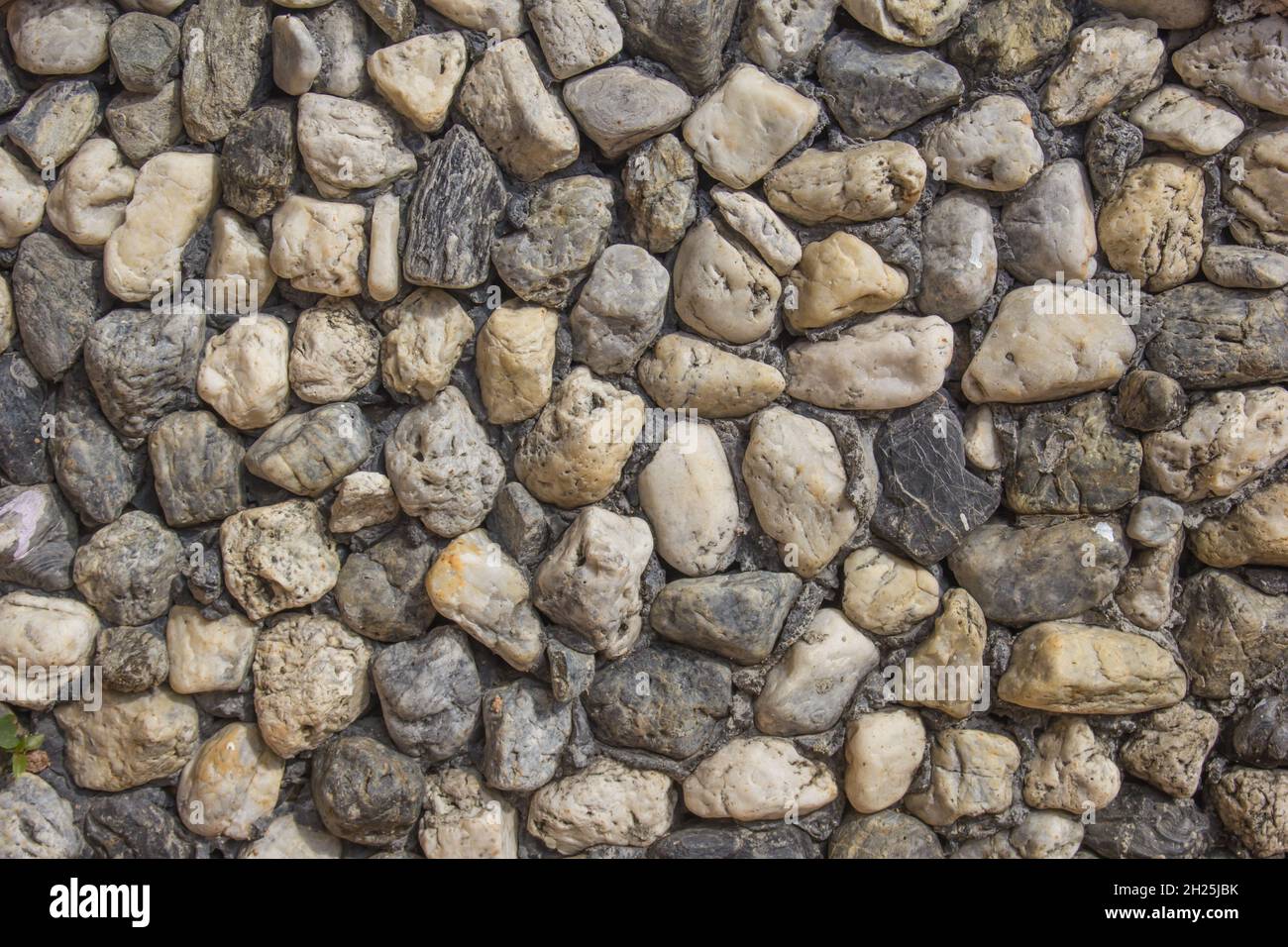 Wall made of small rock.Stone tile texture,Sandstone wall, a wall madei