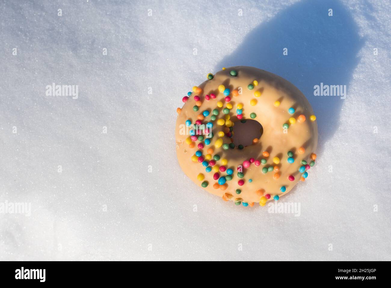 Sweet colorful glazed donuts with icing sprinkles Stock Photo - Alamy