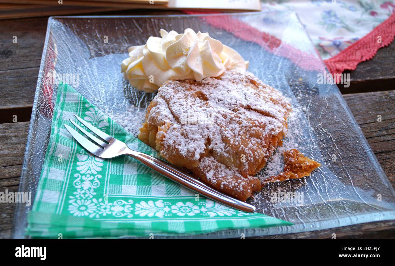 a dilicious Austrian apple pie called Apfelstrudel with whipping cream ...