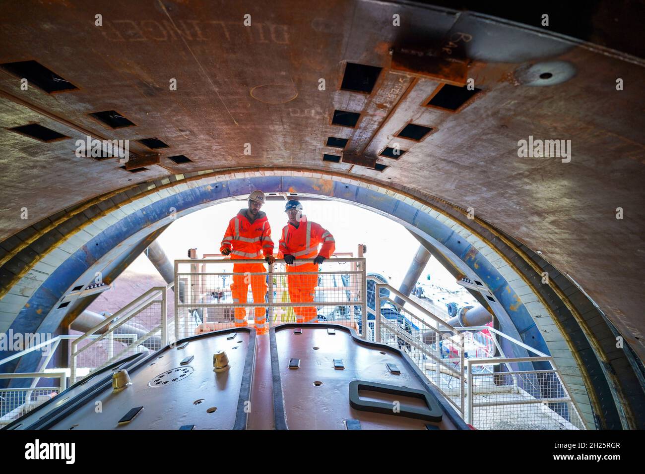 Pete Waterman (right) talks with Mark Shepherd, Tunnel Technical Co-ordinator for BBV at the unveiling of HS2's 2,000 tonne tunnel boring machine that will create a one-mile twin bore tunnel under Long Itchington Wood, Warwickshire. The machine has been named Dorothy, after Dorothy Hodgkin the first British woman to win the Nobel Prize in Chemistry, following a public vote. Picture date: Wednesday October 20, 2021. Stock Photo