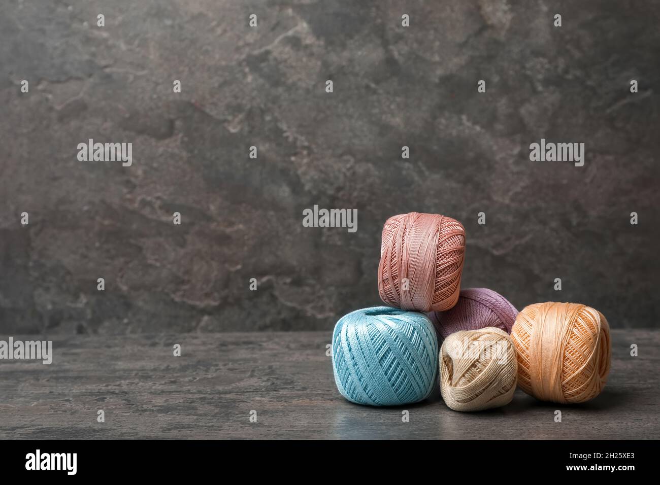 Color threads on gray background Stock Photo - Alamy