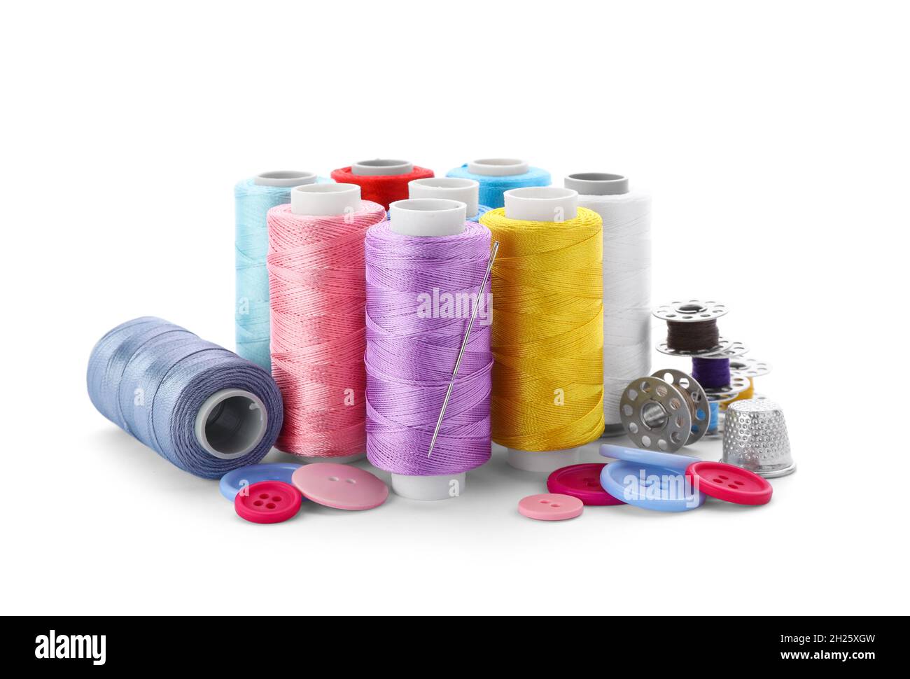 Color threads and sewing accessories on white background Stock Photo ...