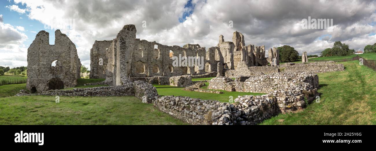 panoramic landscape image of the ruins of  Castle Acre Priory a medieval building in the village of Castle Acre Norfolk England Stock Photo