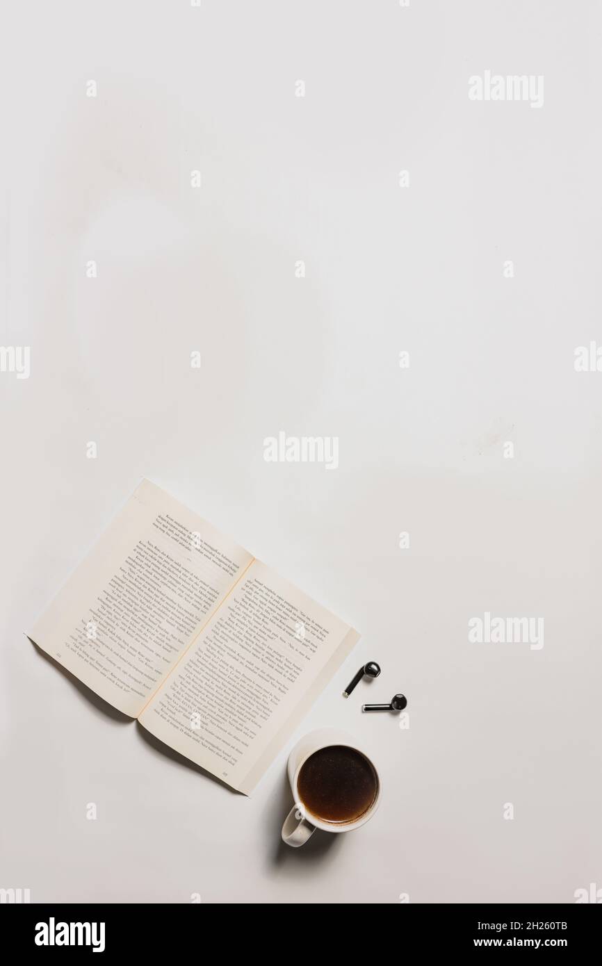 flat lay coffee, books and earphones Stock Photo