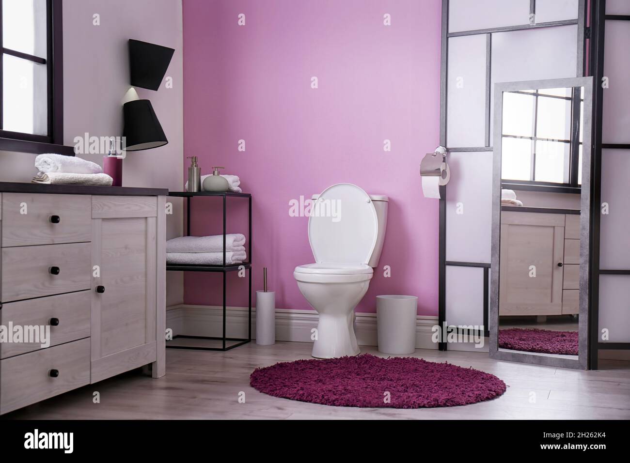 Toilet bowl in modern bathroom interior Stock Photo - Alamy