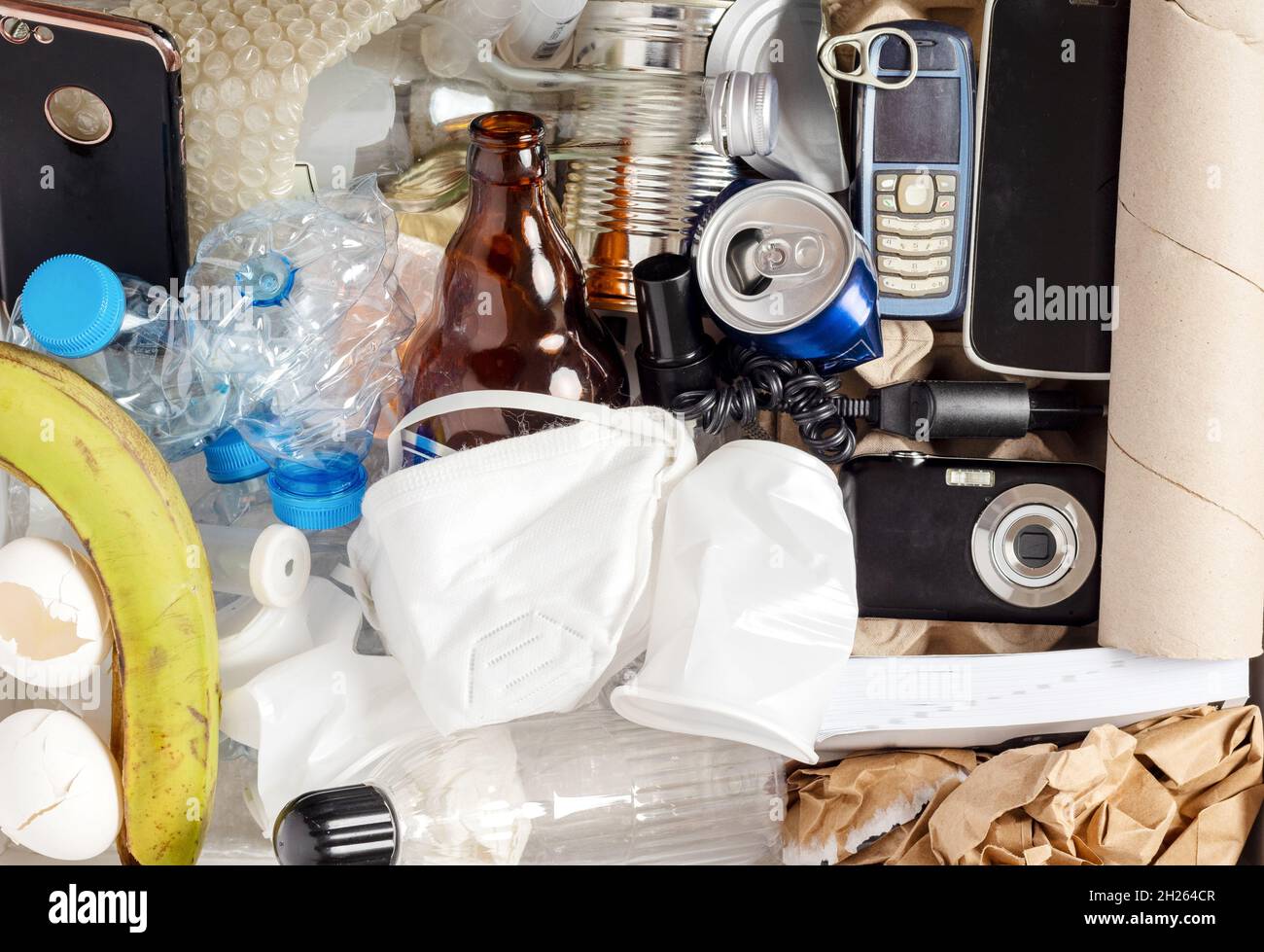 Electronic waste materials laid on green isolated background. waste